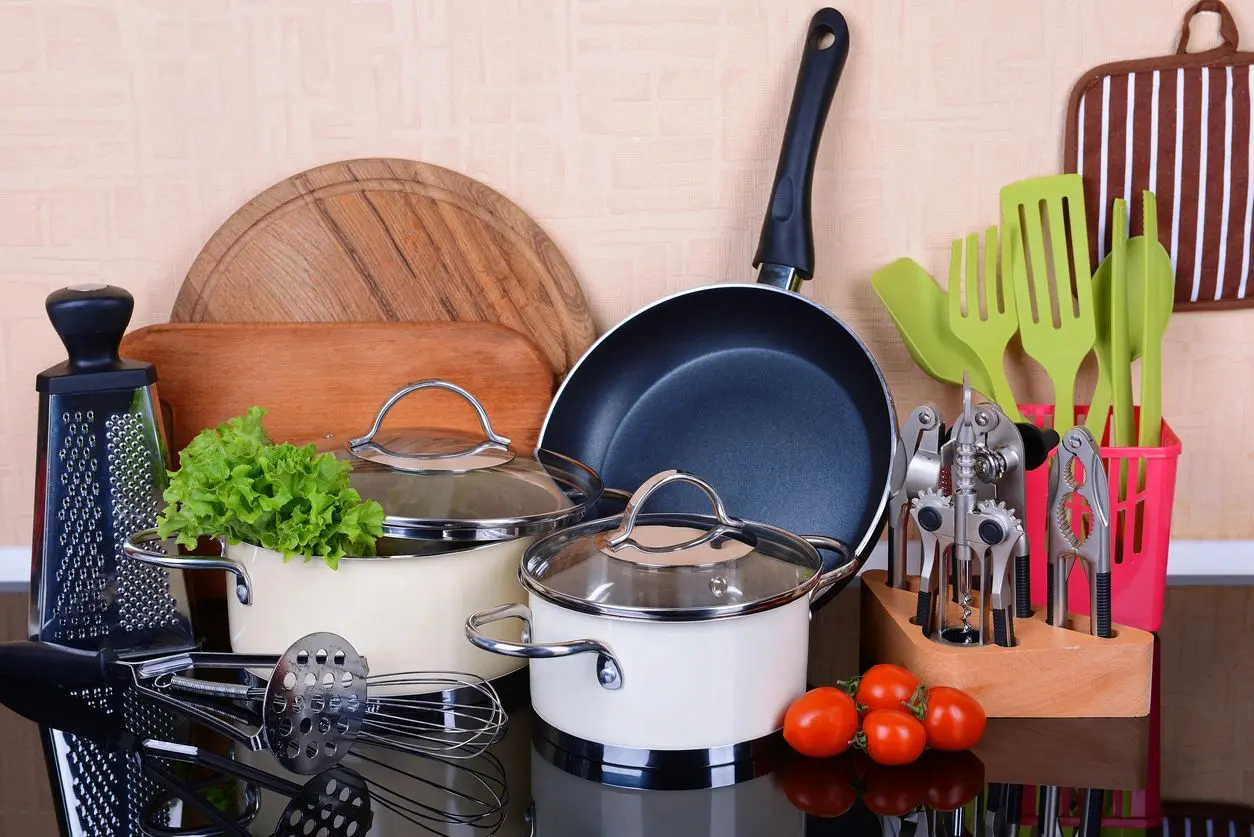 A counter top with pots and pans on it